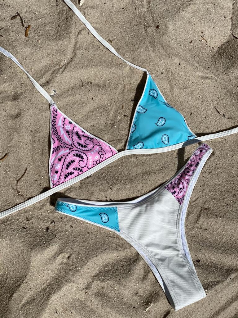 bikini top features a triangle top with a blue and pink bandana/ paisley pattern.